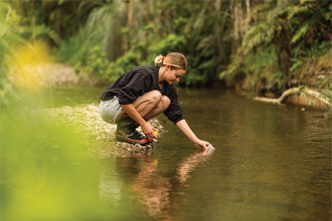 Woman in stream sustainability