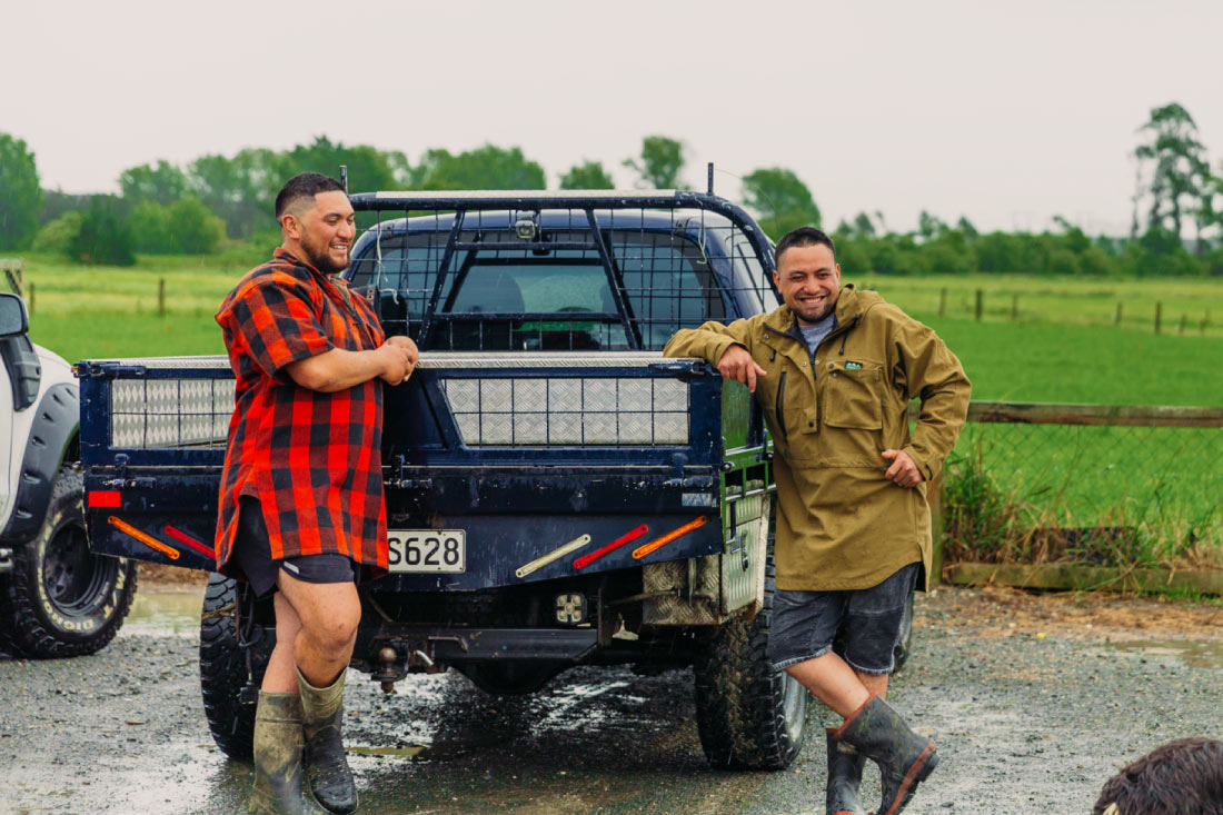 Farmers standing by ute